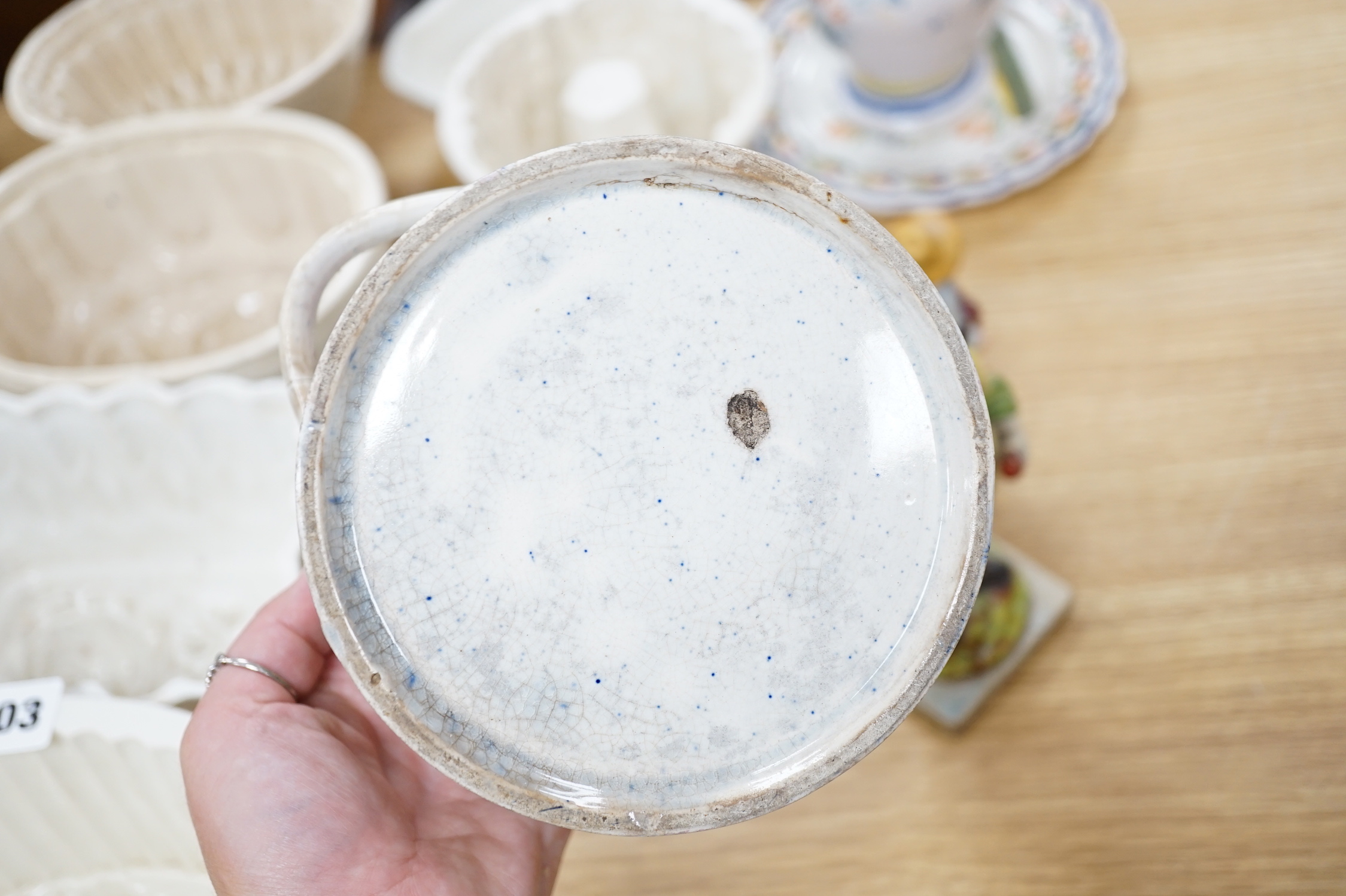 Large collection of mostly 19th century ceramics including Staffordshire figures, jugs, jelly moulds and a twin handled cup, the largest 24cm high